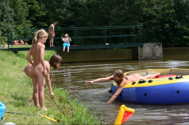 Photo of children of naturist with parents [WorldNudism]