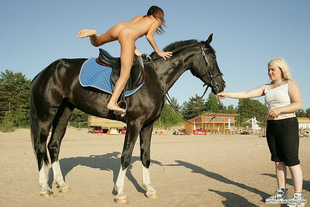 Young nudists in nature learn to ride on horseback video [WorldNudism]